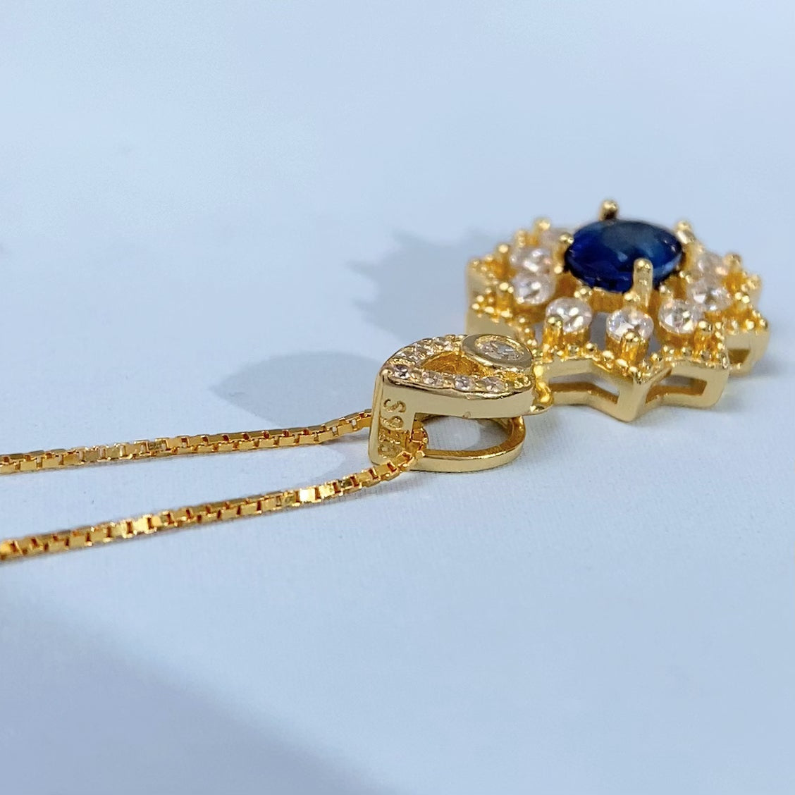 Blue Sapphire Sunburst Gold Vermeil Pendant gold-tone supplier photograph 8568
