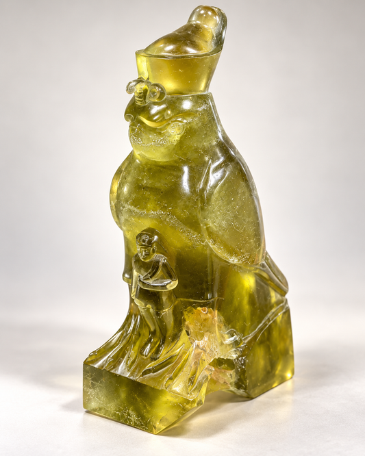 One-of-a-kind carved natural Libyan Desert Glass Horus collector sculpture on neutral background